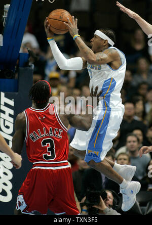 Denver Nuggets guard Allen Iverson (R) drives against Chicago Bulls center Ben Wallace during the first quarter at the Pepsi Center in Denver on November 20, 2007.   (UPI Photo/Gary C. Caskey) Stock Photo