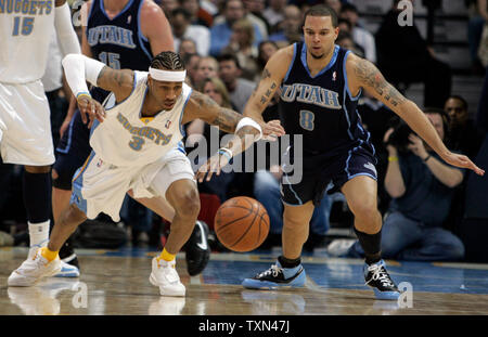 Denver Nuggets guard Allen Iverson (L) and Utah Jazz guard Deron Williams lunge for loose ball during the first quarter at the Pepsi Center in Denver on February 6, 2008.   (UPI Photo/Gary C. Caskey) Stock Photo