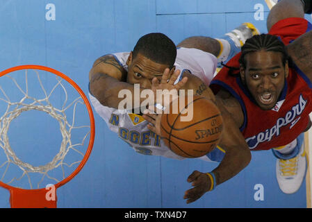 Denver Nuggets center Marcus Camby (L) and Los Angeles Clippers forward Tim Thomas fight for rebound at the Pepsi Center in Denver on February 29, 2008.  Denver beat Los Angeles 110-104.   (UPI Photo/Gary C. Caskey) Stock Photo