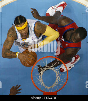 Los Angeles Clippers forward Tim Thomas (R) knocks the ball away from Denver Nuggets forward Carmelo Anthony during the first half at the Pepsi Center in Denver on February 29, 2008.  Denver beat Los Angeles 110-104.   (UPI Photo/Gary C. Caskey) Stock Photo