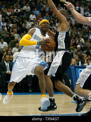 Denver Nuggets guard Allen Iverson (L) drives against San Antonio Spurs guard Tony Parker during the first quarter at the Pepsi Center in Denver on March 7, 2008.    (UPI Photo/Gary C. Caskey) Stock Photo