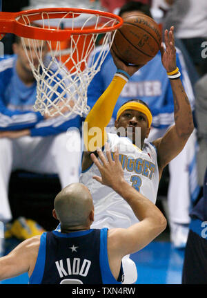 Dallas Mavericks guard Jason Kidd, left, drives around Denver Nuggets ...