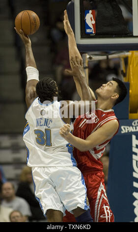 Houston Rockets' Yao Ming of China, right, shoots over Los Angeles ...