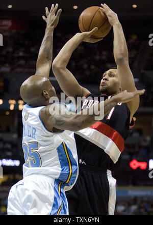 Portland Trailblazers guard Brandon Roy (R) scores over Denver Nuggets guard Anthony Carter during the second quarter at the Pepsi Center in Denver on December 22, 2008.   (UPI Photo/Gary C. Caskey) Stock Photo