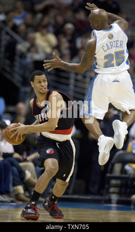 Denver Nuggets guard Anthony Carter (25) defends against Portland Trailblazers guard Brandon Roy during the second half at the Pepsi Center in Denver on December 22, 2008.  Denver beat Portland 97-89 to take the division lead.   (UPI Photo/Gary C. Caskey) Stock Photo