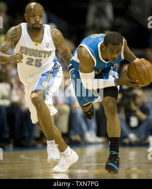 Denver Nuggets guard Anthony Carter (25) trips up New Orleans Hornets guard Chris Paul late in the first quarter during game five of their first round series at the Pepsi Center in Denver on April 29, 2009.     (UPI Photo/Gary C. Caskey) Stock Photo
