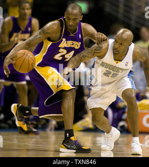 Denver Nuggets guard Anthony Carter (25) tips the ball away from Los Angeles Lakers guard Kobe Bryant in the first half during game six of the Western Conference Finals at the Pepsi Center in Denver on May 29. 2009.   (UPI Photo/Gary C. Caskey) Stock Photo