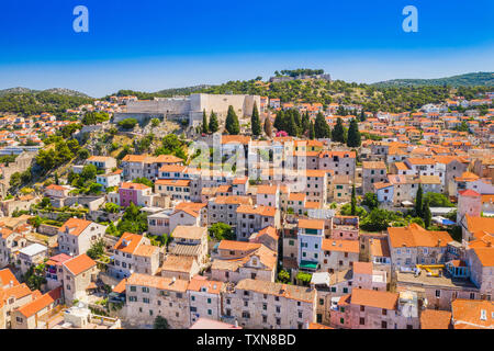 Croatia, city of Sibenik, panoramic view of the old town center, houses on hills and old fortress of St Michael over the city Stock Photo