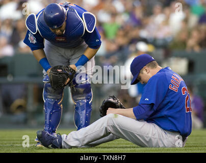 Chicago Cubs catcher Geovany Soto (L) checks on starting pitcher Tom Gorzelanny after he was hit on the leg by a line drive hit by Colorado Rockies left fielder Dexter Fowler during the second inning at Coors Field in Denver on August 10, 2009.       UPI/Gary C. Caskey... Stock Photo