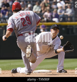 Colorado Rockies second shortstop Clint Barmes eyes a double play against Cincinnati Reds catcher Ryan Hanigan (29) to end the sixth inning at Coors Field in Denver on September 10, 2009.  Colorado trails National League West division leader Los Angeles by 2.5 games and leads the National League Wild Card race.   UPI/Gary C. Caskey... Stock Photo