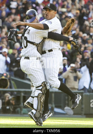 Colorado Rockies relief pitcher Franklin Morales (R) celebrates with catcher Chris Iannetta after striking out the last Milwaukee Brewers batter in the ninth inning at Coors Field in Denver on October 1, 2009.  Colorado clinches the National League wild card defeating Milwaukee 9-2.      UPI/Gary C. Caskey... Stock Photo