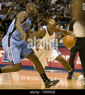 Denver Nuggets guard Chauncey Billups (R) drives past Utah Jazz Ronnie Brewer during the first half at the Pepsi Center in Denver on October 28, 2009.     UPI/Gary C. Caskey... Stock Photo