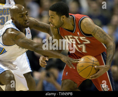 Denver Nuggets guard Chauncey Billups (L) guards New Jersey Nets guard Chris Douglas-Roberts during the first quarter at the Pepsi Center in Denver on November 24, 2009.  New Jersey is the only winless team in the NBA.     UPI/Gary C. Caskey... Stock Photo