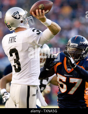 Oakland Raiders quarterback Charlie Frye (3) is sacked by