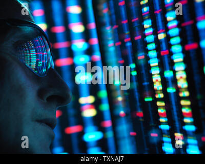 Genetic Research, scientist viewing DNA information on screens, close up Stock Photo