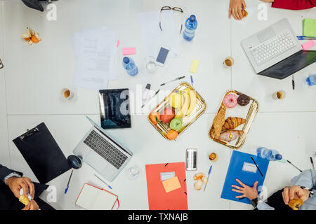 Business partners having tea break at meeting in office Stock Photo