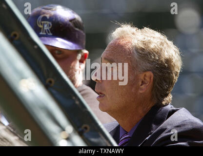 Colorado Rockies Executive Vice President and General Manager Dan O'Dowd (R) watches batting practice under the eye of Rockies Jason Giambi (L) at Coors Field on April 9, 2010 in Denver.  Colorado continues their 18th major league season and hosts San Diego for its 2010 home opener.         UPI/Gary C. Caskey Stock Photo