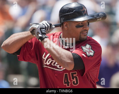 Houston Astros left fielder Carlos Lee waits on a pitch against the Colorado Rockies at Coors Field on June 10, 2010 in Denver.    UPI/Gary C. Caskey Stock Photo