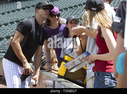 Colorado Rockies pitching ace Ubaldo Jimenez poses for picture with fans at Coors Field on June 10, 2010 in Denver.    UPI/Gary C. Caskey Stock Photo