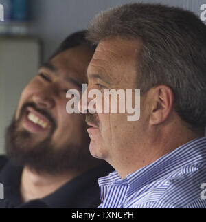 Los Angeles Dodgers General Manager Ned Colletti (R) talks to reporters at Coors Field on August 27, 2010 in Denver.  Los Angeles and Colorado are still in the National League Wild Card race.  UPI/Gary C. Caskey Stock Photo