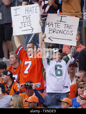 Fans at Invesco Field at Mile High both boo and cheer new Chicago Bears  quarterback Jay Cutler when he enters the game for the first series of  plays in Denver on August