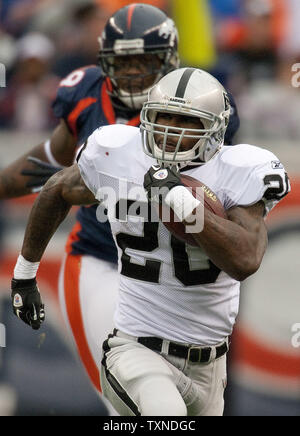 The Oakland Raiders running back Darren McFadden rushed for 165 yards and  three touchdowns against the Denver Broncos at Invesco Field at Mile High  on October 24, 2010 in Denver. Oakland crushed the Broncos 59-14. UPI/Gary  C. Caskey Stock