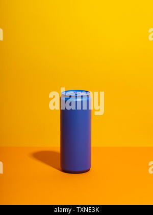 Still life with purple drink can and yellow background Stock Photo