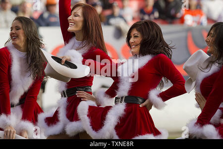 The Denver Broncos cheerleaders perform in Christmas costumes during the  second half at Invesco Field at Mile High in Denver on December 20, 2009.  Oakland beat Denver 20-19. UPI/Gary C. Caskey Stock