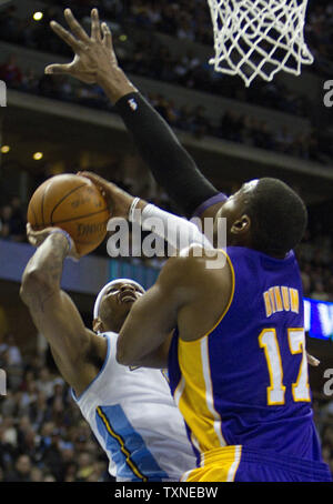 Denver Nuggets forward Carmelo Anthony (L) scores over Los Angeles Lakers Andrew Bynum during the first quarter at the Pepsi Center in Denver on January 21, 2011.     UPI/Gary C. Caskey Stock Photo