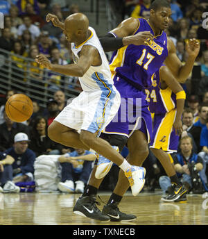 Denver Nuggets guard Chauncey Billups (L) collides with Los Angeles Lakers center Andrew Bynum at the Pepsi Center in Denver on January 21, 2011.   The Lakers beat the Nuggets 107-97.      UPI/Gary C. Caskey Stock Photo