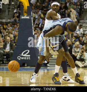 Denver Nuggets guard Ty Lawson (L) knocks the ball away from Memphis Grizzlies forward Zach Randolph during the first quarter at the Pepsi Center in Denver on February 22, 2011.   UPI/Gary C. Caskey Stock Photo
