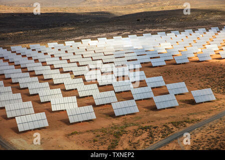 Rows of solar panels in arid landscape, aerial view, Cape Town, Western Cape, South Africa Stock Photo