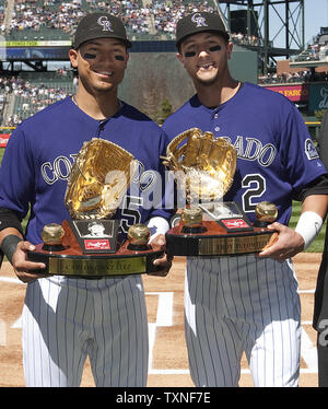 Colorado Rockies Carlos Gonzalez (L) and Troy Tulowitzki hold