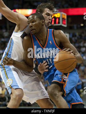 Oklahoma City Thunder forward Kevin Durant (R) drives against Denver Nuggets forward Danilo Gallinari in the Western Conference playoffs-First Round game three at the Pepsi Center in Denver on April 23, 2011.  The Thunder take a 3-0 series lead over the Nuggets with a 97-94 win.      UPI/Gary C. Caskey Stock Photo