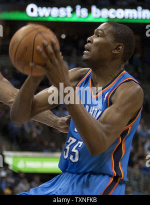 Oklahoma City Thunder forward Kevin Durant sets for shot against the Denver Nuggets during the second half in the Western Conference Playoffs-First Round game four at the Pepsi Center in Denver on April 25, 2011.   Denver avoided a sweep by Oklahoma City winning 104-101.       UPI/Gary C. Caskey Stock Photo