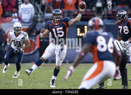 Denver Broncos quarterback Tim Tebow passes to tight end Daniel Fells late in the fourth quarter against the San Diego Chargers at Sports Authority Field at Mile High on October 9, 2011 in Denver.   Despite a comeback effort from Broncos quarterback Tim Tebow, the Chargers held on for a 29-24 win.      UPI/Gary C. Caskey Stock Photo