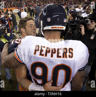 Chicago Bears defensive end Julius Peppers (90) stands on the sidelines  late in the fourth quarter against the Dallas Cowboys at Soldier Field in  Chicago on December 9, 2013. The Bears defeated