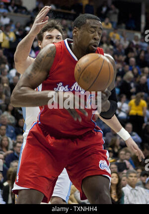 Denver Nuggets forward Danilo Gallinari fouls Los Angeles Clippers center DeAndre Jordan during the first quarter at the Pepsi Center on January 29, 2012 in Denver.        UPI/Gary C. Caskey Stock Photo