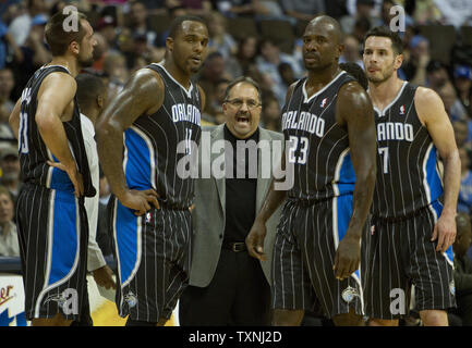 Orlando Magic head coach Stan Van Gundy (C) talks to his team without the services of center Dwight Howard due to surgery during the second quarter at the Pepsi Center on April 22, 2012 in Denver.  The Nuggets tied with the Dallas Mavericks for sixth look to move up in the Western Conference playoff seedings with a win over the sixth seeded Eastern Conference Magic.   UPI/Gary C. Caskey Stock Photo