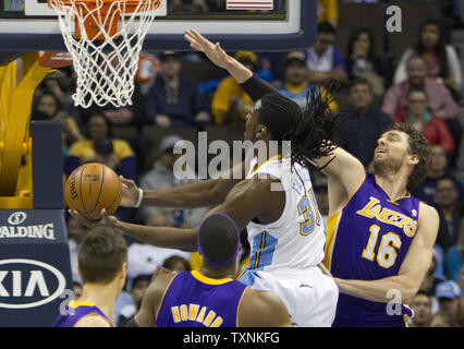 Los Angeles Lakers center Pau Gasol (16) of Spain, and his brother and Memphis  Grizzlies center Marc Gasol (33) jockey for position during the first half  of an NBA basketball game in