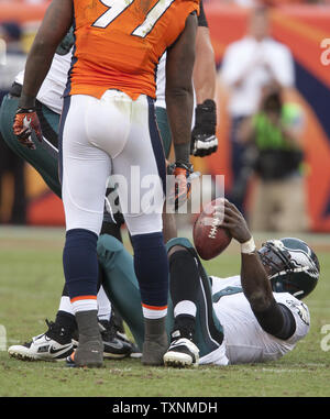 Philadelphia Eagles Michael Vick stands on the sidelines in the