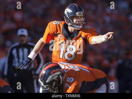 Denver Broncos quarterback Peyton Manning directs his offense against the New England Patriots at the AFC Championship game at Sports Authority Field at Mile High in Denver on January 19, 2014.   Denver will be the home team against the Seattle Seahawks in Super Bowl XLVIII at MetLife Stadium in East Rutherford, New Jersey February 2nd.   (FILE PHOTO)  UPI/Gary C. Caskey Stock Photo