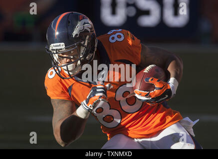 FILE - Denver Broncos wide receiver Jerry Jeudy (10) adjusts his equipment  before an NFL football game against the Las Vegas Raiders, Sunday, Dec. 26,  2021, in Las Vegas. At the request