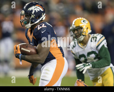 Denver Broncos running back C.J. Anderson hugs New England