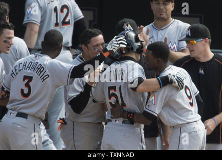 Teammates congratulate Miami Marlins outfielder Ichiro Suzuki after his seventh inning triple put him at 3,000 hits at Coors Field in Denver on August 7, 2016.  Ichiro becomes the 30th player in Major League history to record 3,000hits.  Photo by Gary C. Caskey/UPI Stock Photo