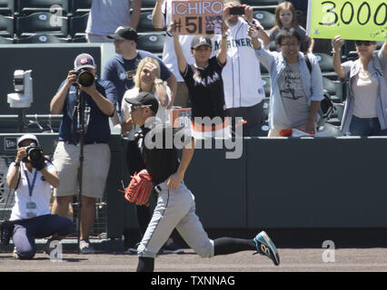 Miami Marlins outfielder Ichiro Suzuki runs past fans after warm up at Coors Field in Denver on August 7, 2016.  Ichiro becomes the 30th player in Major League history to record 3,000hits.  Photo by Gary C. Caskey/UPI Stock Photo