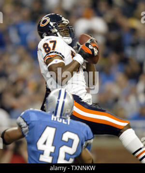 Chicago Bears wide receiver Muhsin Muhammad, (87) celebrates his first  quarter touchdown with Bernard Berrian, (80) and Cedric Benson, (32) during  their NFL football game at Soldier Field in Chicago, Ill., Sunday