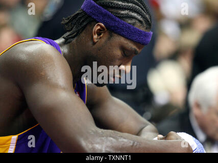 Los Angeles Lakers Kwame Brown takes a break on the bench during the second quarter against Detroit Pistons at The Palace of Auburn Hills in Auburn, MI on January 29, 2006.  The Pistons defeated the Lakers 102-93.  (UPI Photo/Scott R. Galvin) Stock Photo