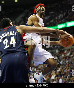 Detroit Pistons guard Richard Hamilton gets fouled by Cleveland Cavaliers forward Donyell Marshall (24) in the third quarter at the Palace of Auburn Hills in Auburn Hills, Mi on April 12, 2006. The Pistons defeated the Cavaliers 96-73.  (UPI Photo/Scott R. Galvin) Stock Photo
