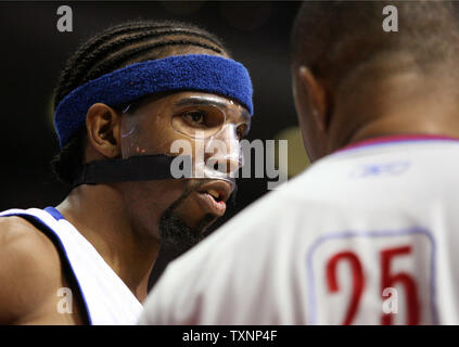 Detroit Pistons guard Richard Hamilton talks with referee Tony Brothers in the fourth quarter against the Milwaukee Bucks at The Palace of Auburn Hills in Auburn Hills, Mi on April 26, 2006.  The Pistons defeated the Bucks 109-98.  (UPI Photo/Scott R. Galvin) Stock Photo